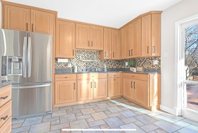 1933 Birch St, Des Plaines, IL 60018 - kitchen with stainless steel fridge with ice dispenser, stone finish flooring, backsplash, and dark stone counters