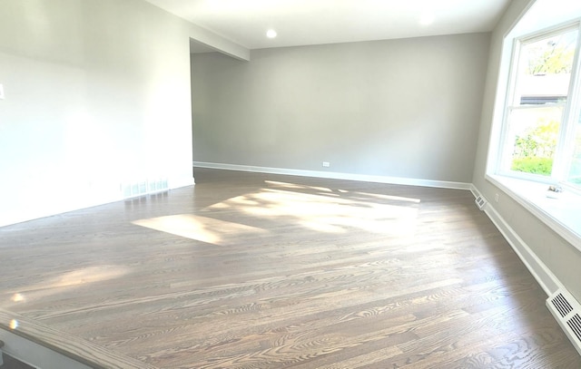 1933 Birch St, Des Plaines, IL 60018 - empty room featuring dark wood-style flooring and baseboards