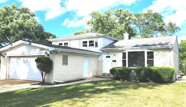 1933 Birch St, Des Plaines, IL 60018 - view of front of property featuring a garage, brick siding, a chimney, and a front yard