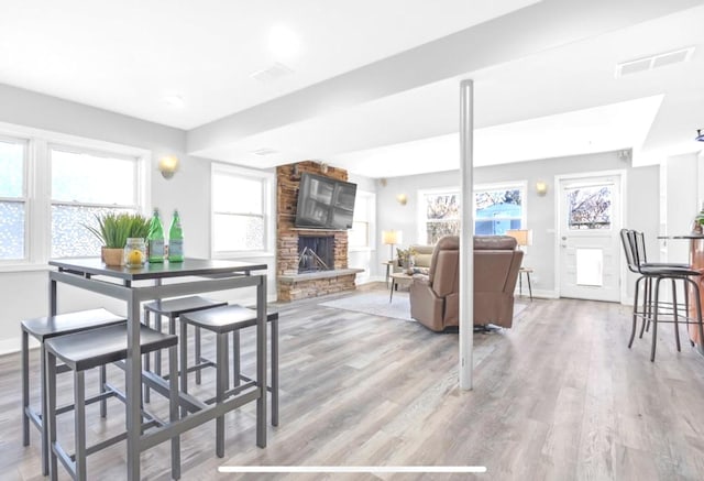 1933 Birch St, Des Plaines, IL 60018 - dining room with a stone fireplace and wood finished floors