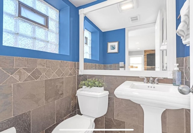 1933 Birch St, Des Plaines, IL 60018 - half bath featuring tile walls and a wainscoted wall