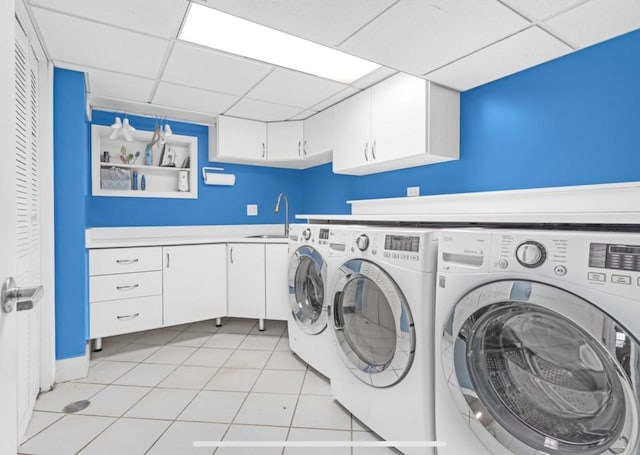 1933 Birch St, Des Plaines, IL 60018 - laundry area with independent washer and dryer, cabinet space, and light tile patterned flooring