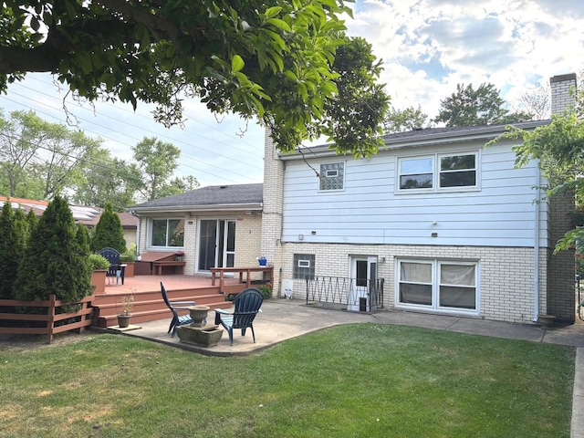 1933 Birch St, Des Plaines, IL 60018 - rear view of property with a patio area, a deck, brick siding, and a chimney