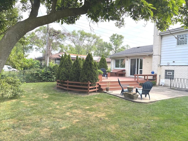 1933 Birch St, Des Plaines, IL 60018 - view of grassy yard featuring a deck and a patio