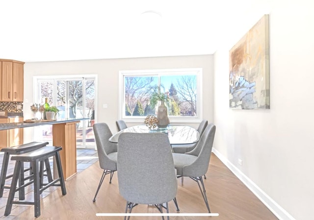 1933 Birch St, Des Plaines, IL 60018 - dining area with light wood-type flooring and baseboards