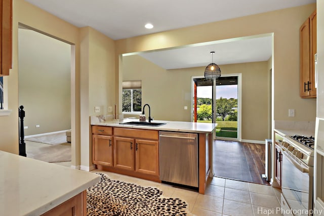 548 Legend Ln, Mchenry, IL 60050 - kitchen featuring dishwasher, white gas range, a peninsula, light countertops, and plenty of natural light