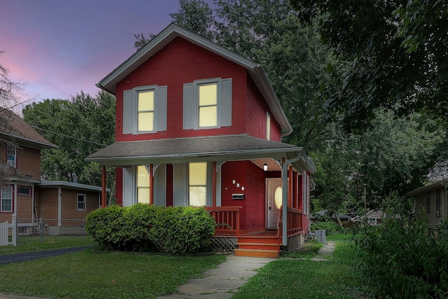 528 5th St, Aurora, IL 60505 - view of front of home with a porch, a front lawn, and a shingled roof