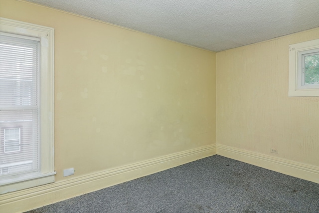 528 5th St, Aurora, IL 60505 - carpeted spare room with a textured ceiling