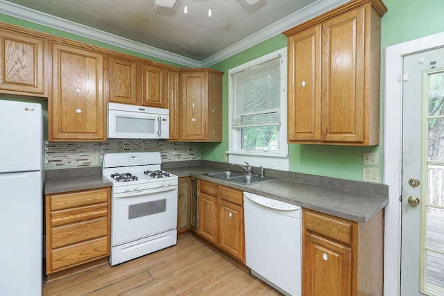 528 5th St, Aurora, IL 60505 - kitchen featuring white appliances, crown molding, light wood-style floors, dark countertops, and tasteful backsplash