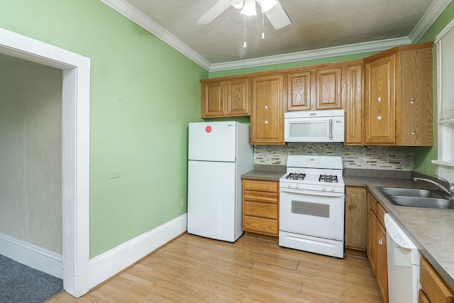 528 5th St, Aurora, IL 60505 - kitchen featuring white appliances, crown molding, light wood finished floors, ceiling fan, and brown cabinetry