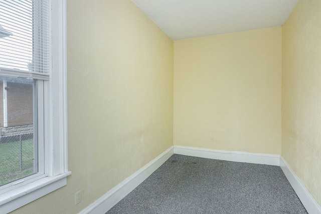 528 5th St, Aurora, IL 60505 - empty room featuring carpet flooring and baseboards
