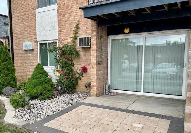 2B Dundee Quarter Unit 101, Palatine, IL 60074 - property entrance with brick siding and a balcony