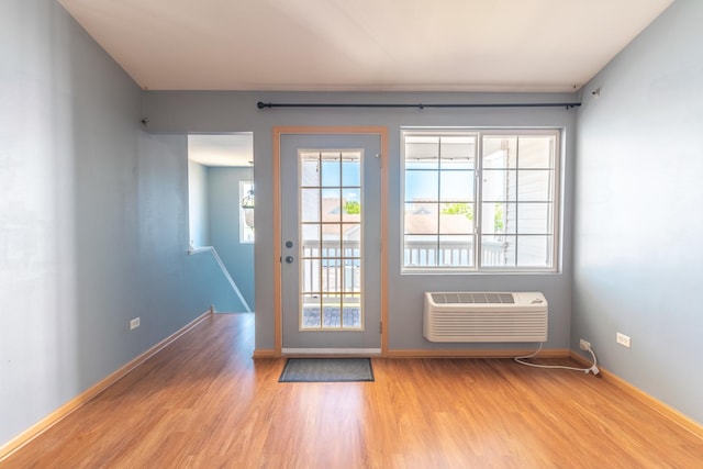 1521 Silverstone Dr Unit 3, Carpentersville, IL 60110 - entryway featuring wood finished floors and a wall mounted air conditioner