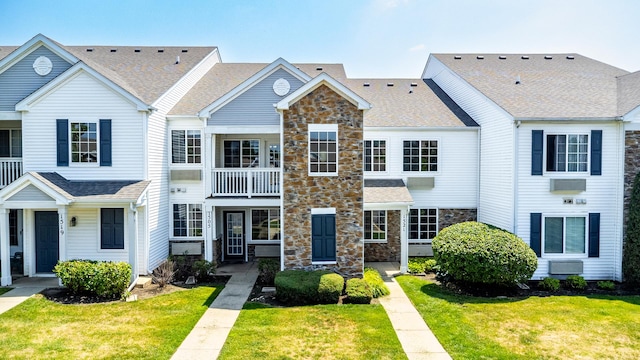 1521 Silverstone Dr Unit 3, Carpentersville, IL 60110 - view of front facade with stone siding, a shingled roof, and a front lawn