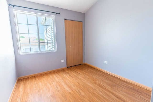 1521 Silverstone Dr Unit 3, Carpentersville, IL 60110 - unfurnished bedroom with light wood finished floors and a closet