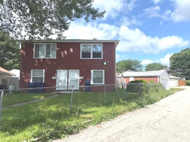 622 N Pine St, Waukegan, IL 60085 - view of front of property featuring a garage