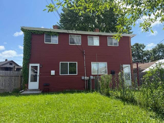 622 N Pine St, Waukegan, IL 60085 - back of house with a chimney