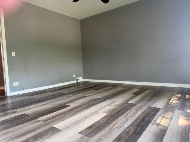 622 N Pine St, Waukegan, IL 60085 - spare room featuring ceiling fan and wood finished floors