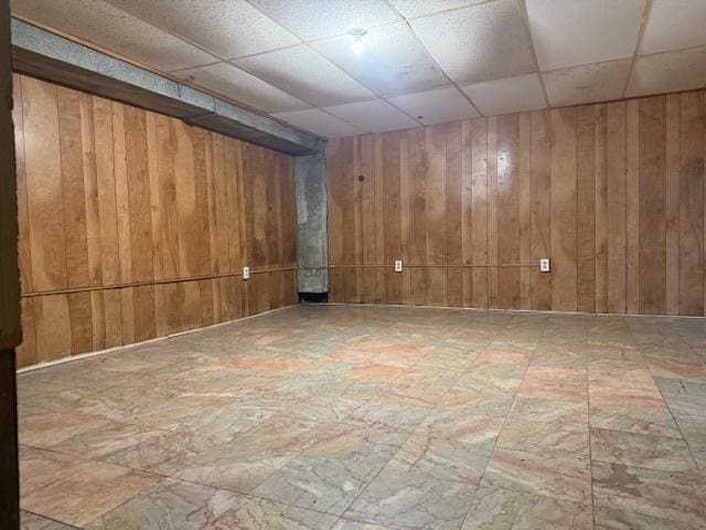 622 N Pine St, Waukegan, IL 60085 - empty room with a paneled ceiling and wood walls