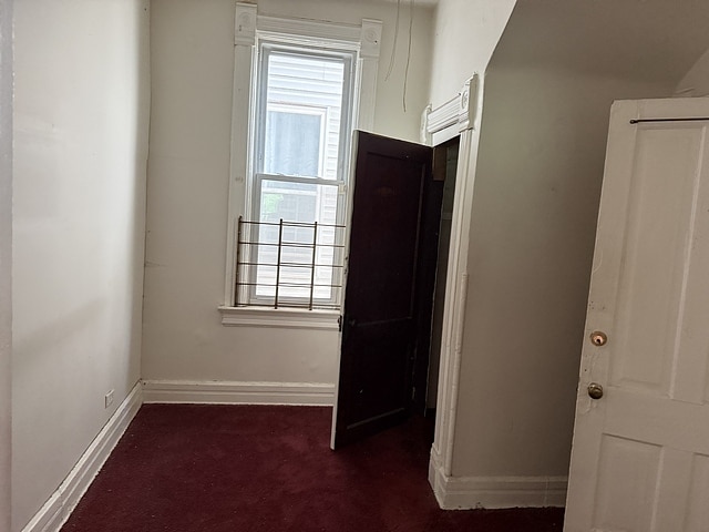 6044 S Justine St, Chicago, IL 60636 - unfurnished bedroom featuring carpet floors and multiple windows