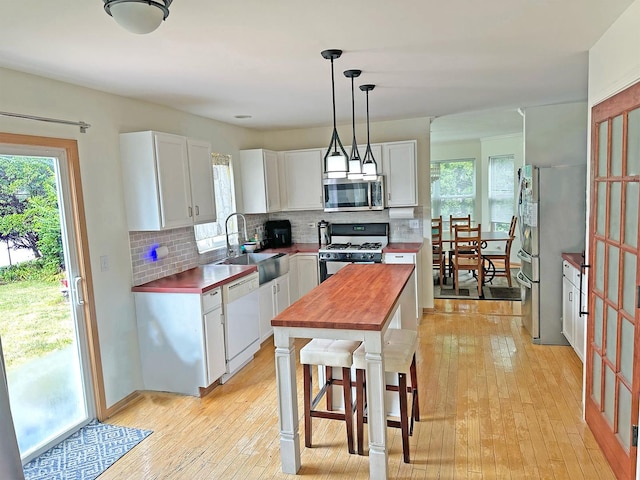 6814 Sahara Dr, Plainfield, IL 60586 - kitchen featuring stainless steel appliances, butcher block counters, white cabinetry, and light wood-style flooring