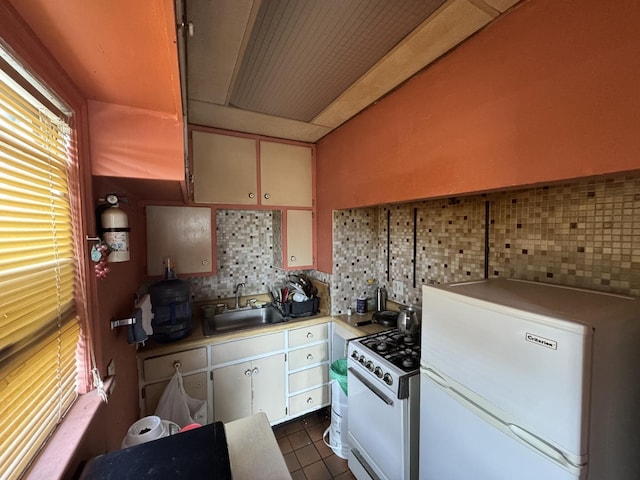 368 N Hickory St, Joliet, IL 60435 - kitchen with fridge, white range with gas cooktop, backsplash, and light countertops