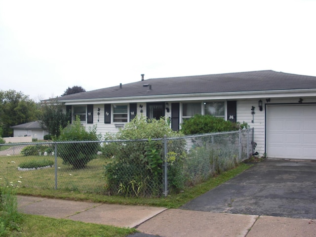 513 Overland Trl, Rockford, IL 61101 - ranch-style house with an attached garage and asphalt driveway