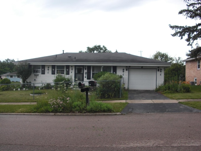 513 Overland Trl, Rockford, IL 61101 - single story home with a garage and asphalt driveway