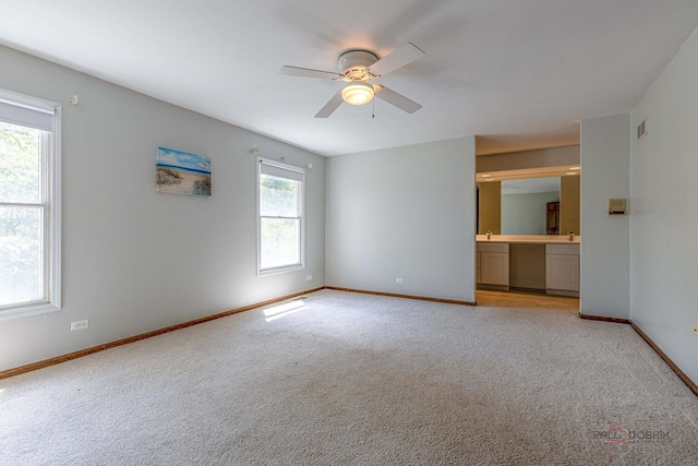 851 Sutton Ct, Lincolnshire, IL 60069 - unfurnished bedroom featuring light colored carpet, connected bathroom, and ceiling fan