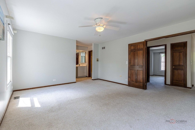 851 Sutton Ct, Lincolnshire, IL 60069 - unfurnished bedroom with light colored carpet, ceiling fan, and ensuite bathroom