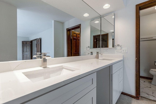 851 Sutton Ct, Lincolnshire, IL 60069 - bathroom featuring double vanity, recessed lighting, and marble finish flooring