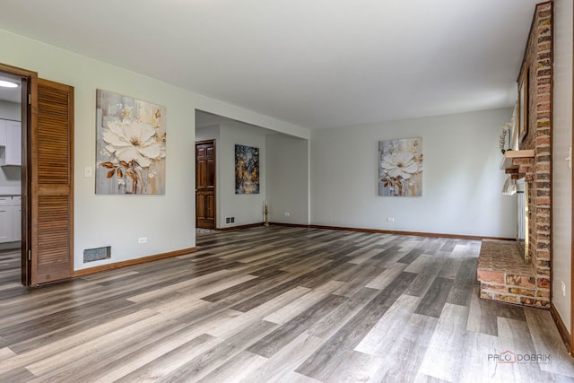 851 Sutton Ct, Lincolnshire, IL 60069 - unfurnished living room with wood finished floors and a fireplace