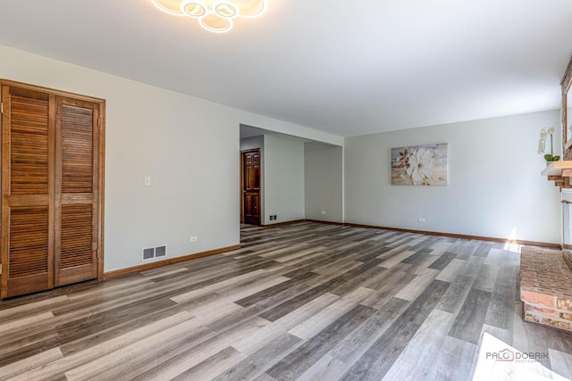851 Sutton Ct, Lincolnshire, IL 60069 - unfurnished living room with wood finished floors and baseboards