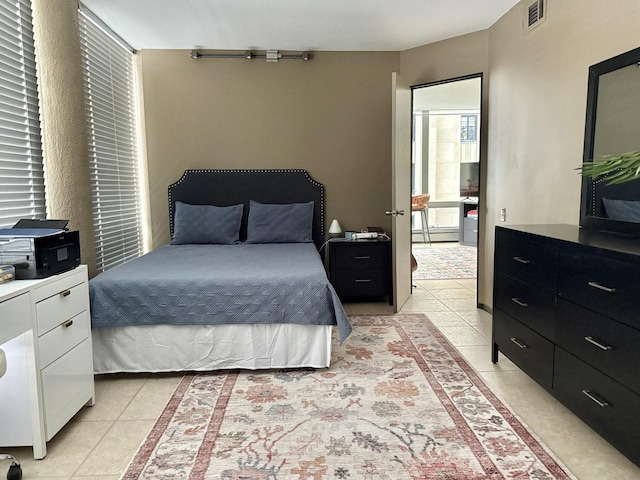 1300 N Astor St Unit 6B, Chicago, IL 60610 - bedroom featuring light tile patterned floors and a baseboard radiator