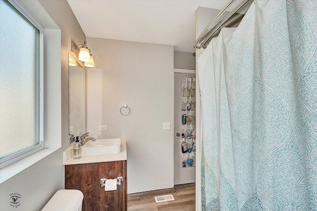 1112 Kim Ct, Joliet, IL 60431 - bathroom featuring wood finished floors and vanity