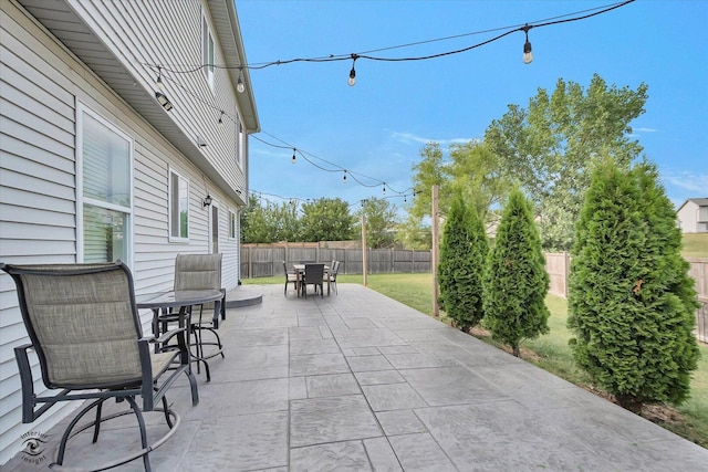 1112 Kim Ct, Joliet, IL 60431 - fenced backyard with outdoor dining space and a patio area