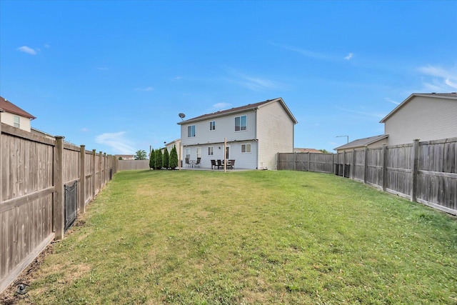1112 Kim Ct, Joliet, IL 60431 - back of property with a fenced backyard and a patio