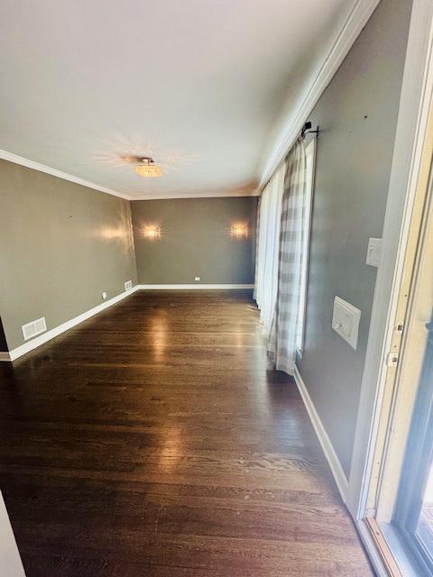 2544 W 107th St, Chicago, IL 60655 - spare room with wood finished floors and crown molding