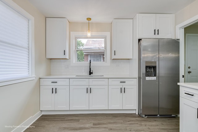 15223 Cottage Grove Ave, Dolton, IL 60419 - kitchen with stainless steel refrigerator with ice dispenser, white cabinetry, and decorative backsplash