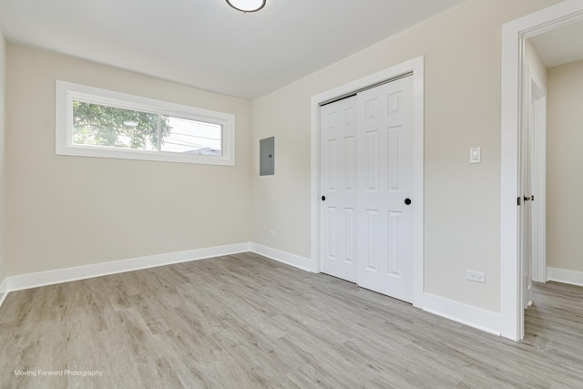 15223 Cottage Grove Ave, Dolton, IL 60419 - unfurnished bedroom featuring electric panel, wood finished floors, and a closet