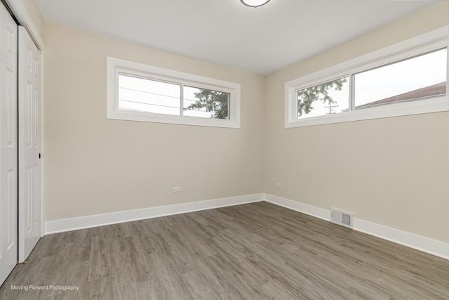 15223 Cottage Grove Ave, Dolton, IL 60419 - unfurnished bedroom featuring wood finished floors and a closet