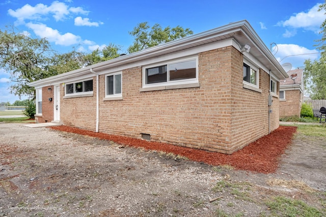 15223 Cottage Grove Ave, Dolton, IL 60419 - view of home's exterior with brick siding and crawl space