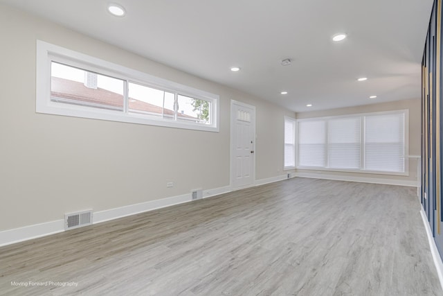 15223 Cottage Grove Ave, Dolton, IL 60419 - unfurnished living room with light wood-type flooring and recessed lighting