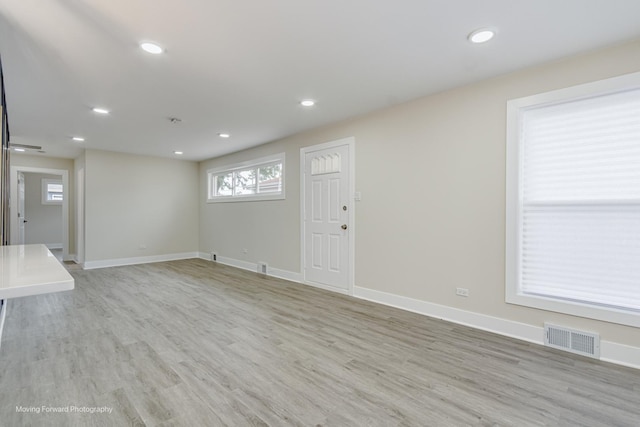 15223 Cottage Grove Ave, Dolton, IL 60419 - unfurnished living room with light wood-style flooring and recessed lighting