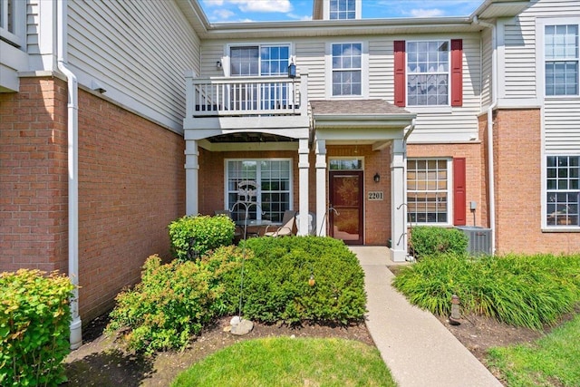 2201 Concord Dr Unit 2201, Mchenry, IL 60050 - doorway to property featuring a balcony and brick siding