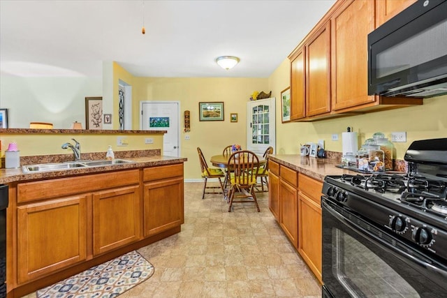 2201 Concord Dr Unit 2201, Mchenry, IL 60050 - kitchen with black appliances, brown cabinets, and stone finish floors