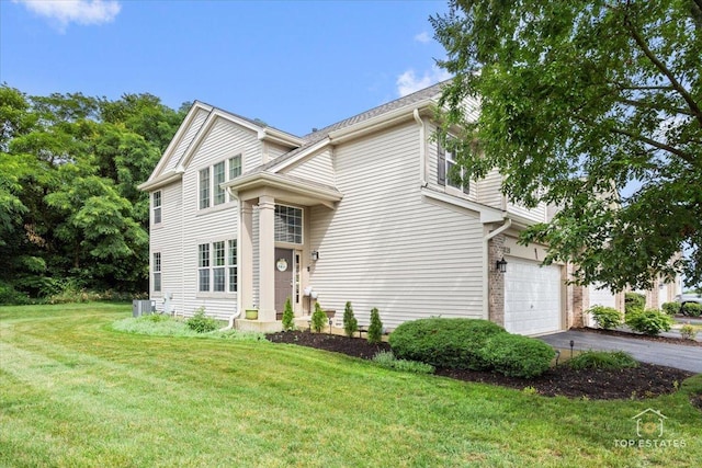 2039 Muirfield Dr, Yorkville, IL 60560 - view of front of home with driveway, a front yard, and an attached garage