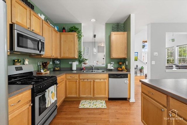 2039 Muirfield Dr, Yorkville, IL 60560 - kitchen featuring appliances with stainless steel finishes, dark countertops, light wood finished floors, and recessed lighting