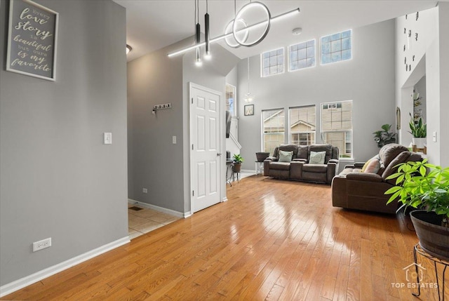 2039 Muirfield Dr, Yorkville, IL 60560 - living area featuring light wood-style floors and a high ceiling