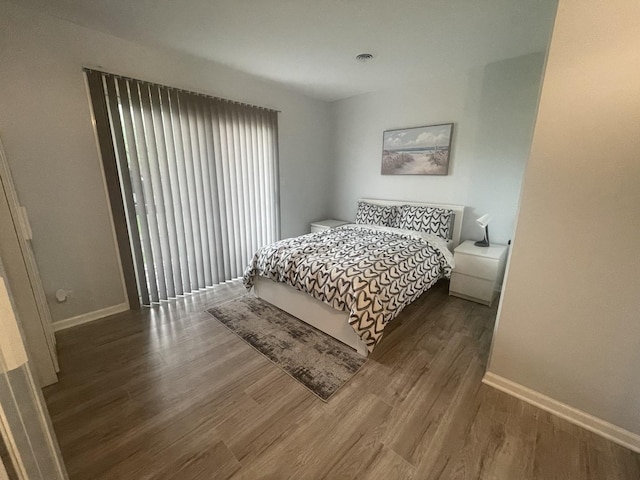64 Aspen Colony Unit 5, Fox Lake, IL 60020 - bedroom with wood finished floors and baseboards